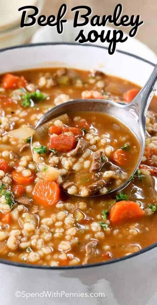 Beef Barley Soup in a pot with a ladle with writing