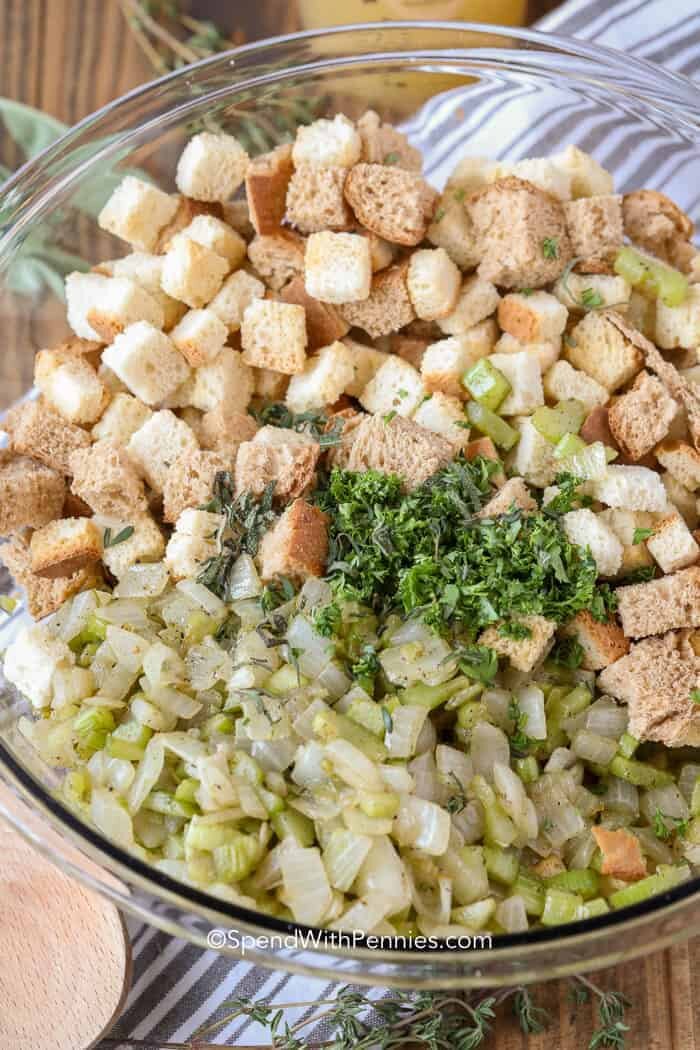 Homemade Stuffing ingredients in clear glass bowl before mixing together