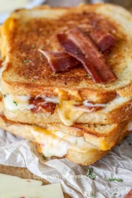 Bacon Grilled Cheese sandwiches on parchment paper