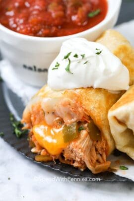 Chicken Burritos with sour cream on top