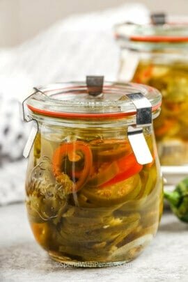 close up of Quick Pickled Jalapenos in jars