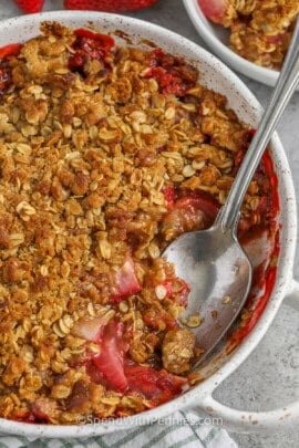 dish of Strawberry Rhubarb Crisp with a portion taken out